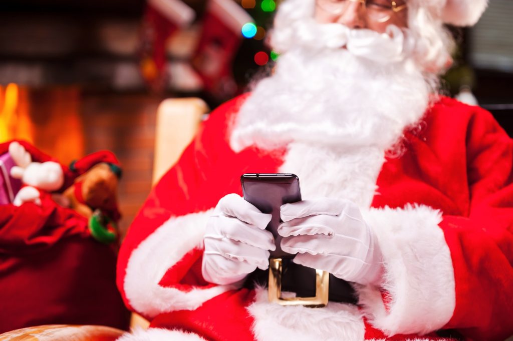 Santa Claus texting.